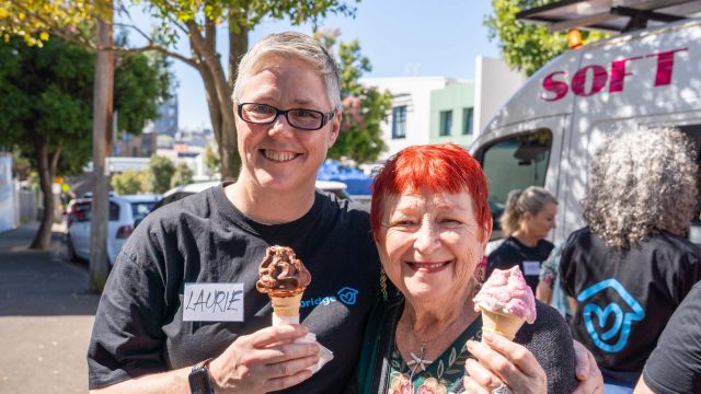 Laurie and tenant eating ice cream at Spring picnic - one year on