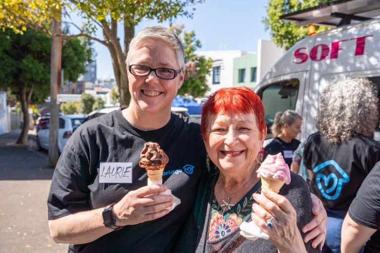 Laurie and tenant eating ice cream at Spring picnic - one year on