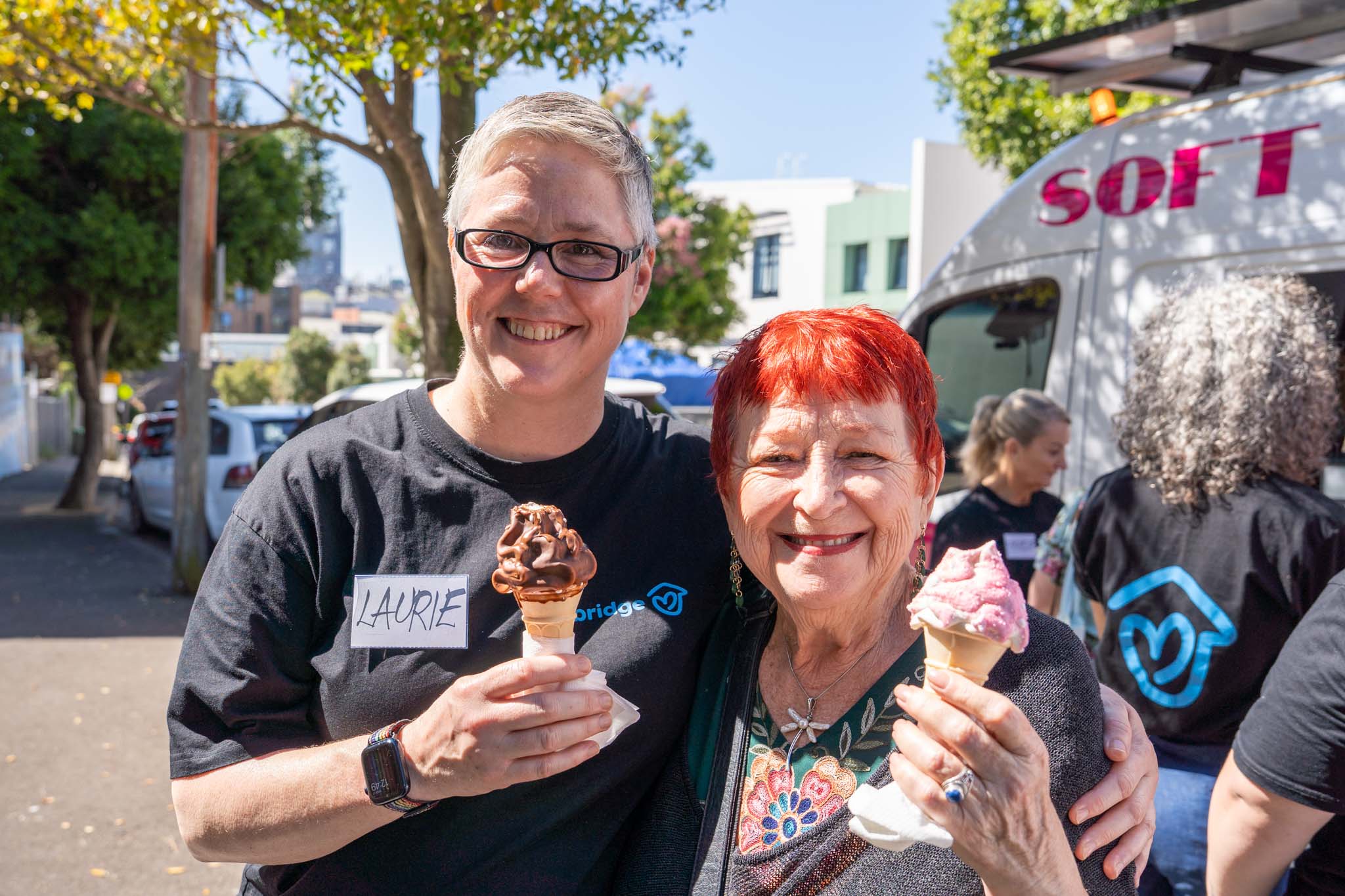 Laurie and tenant eating ice cream at Spring picnic - one year on