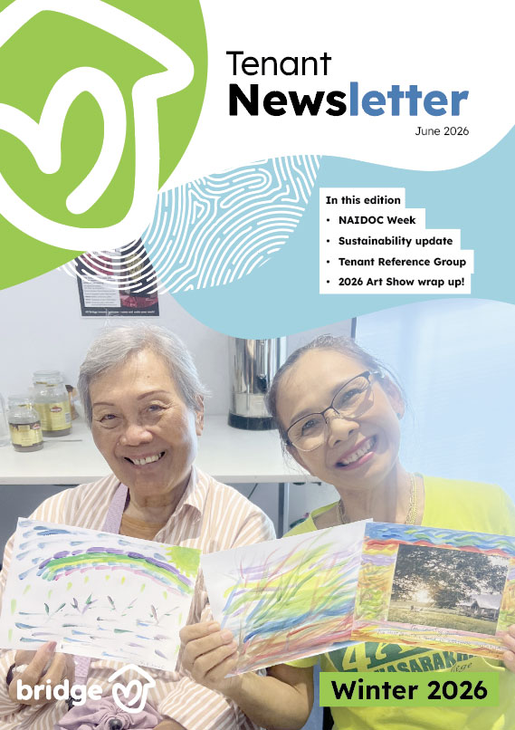 Cover image of the newsletter - two people smiling holding paintings that they have just completed