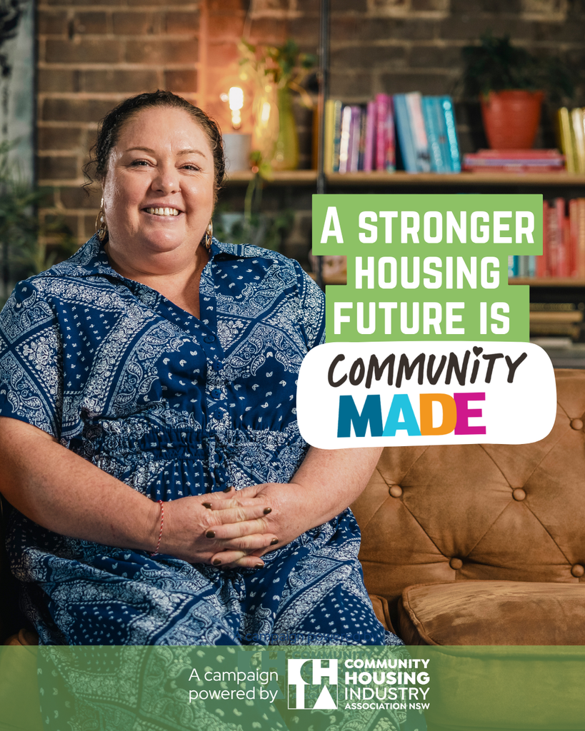 A woman sitting in her apartment smiling with the words A stronger housing future is community made